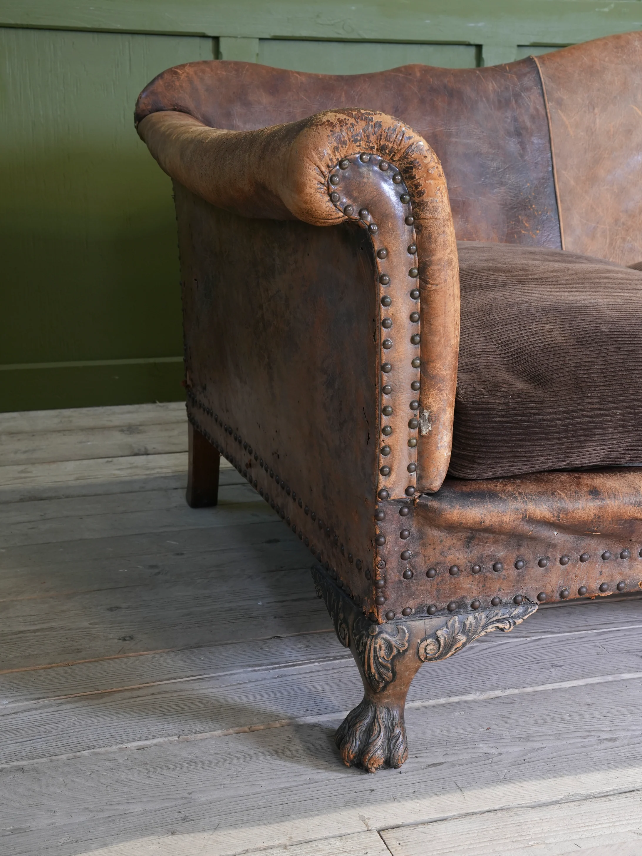 A Large Leather Camelback Sofa - Image 10