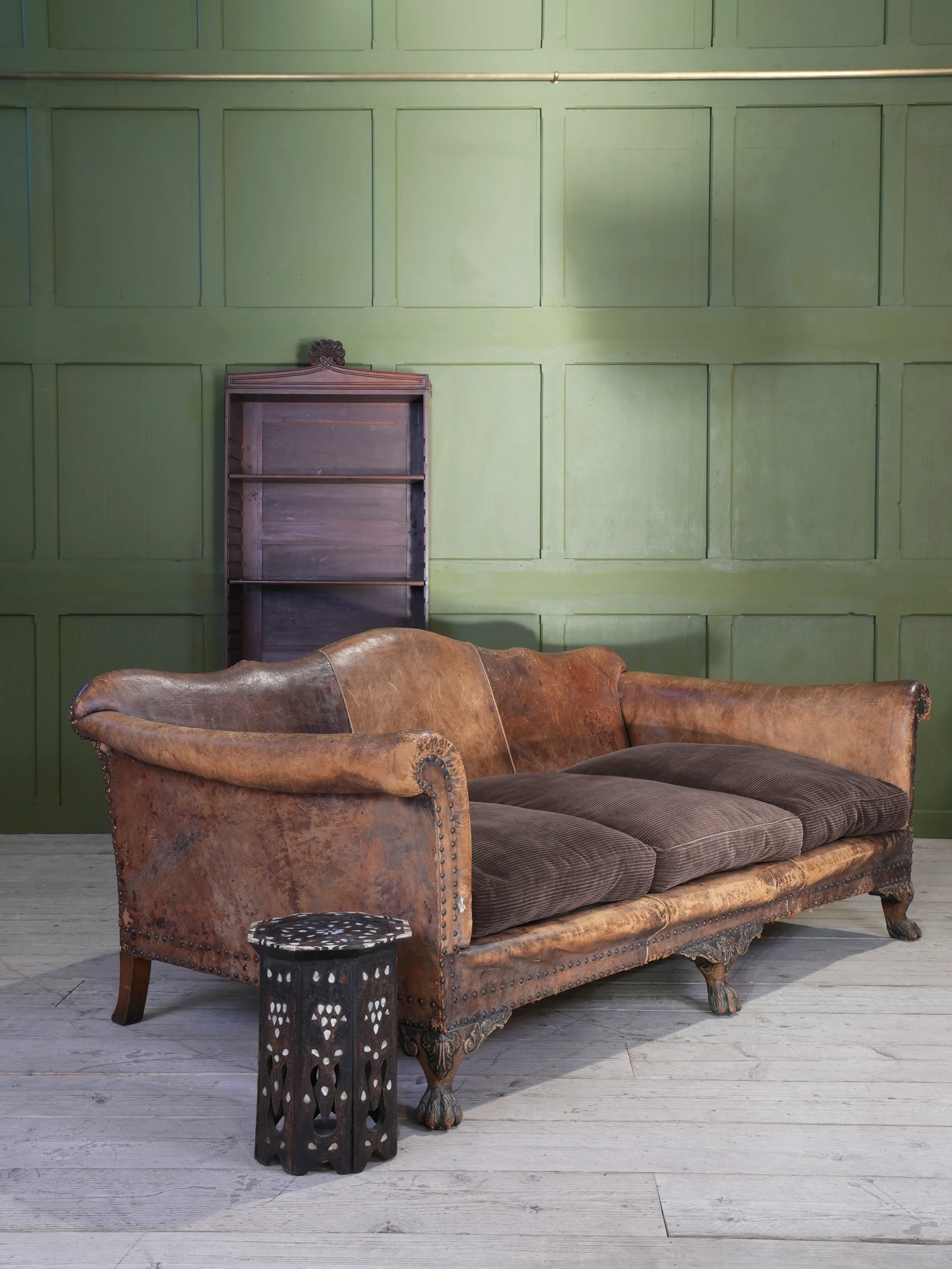 A Large Leather Camelback Sofa - Image 18