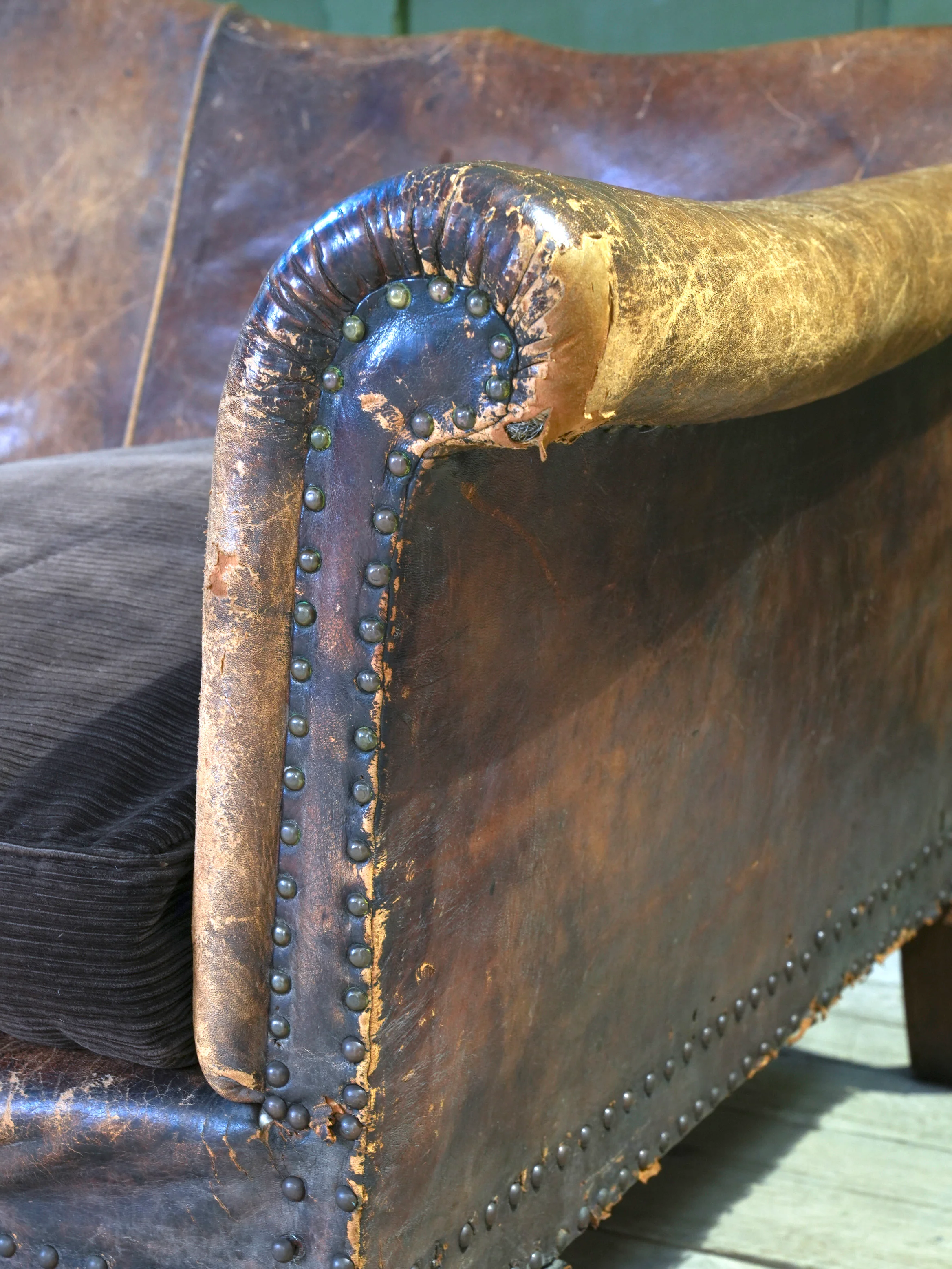 A Large Leather Camelback Sofa - Image 7