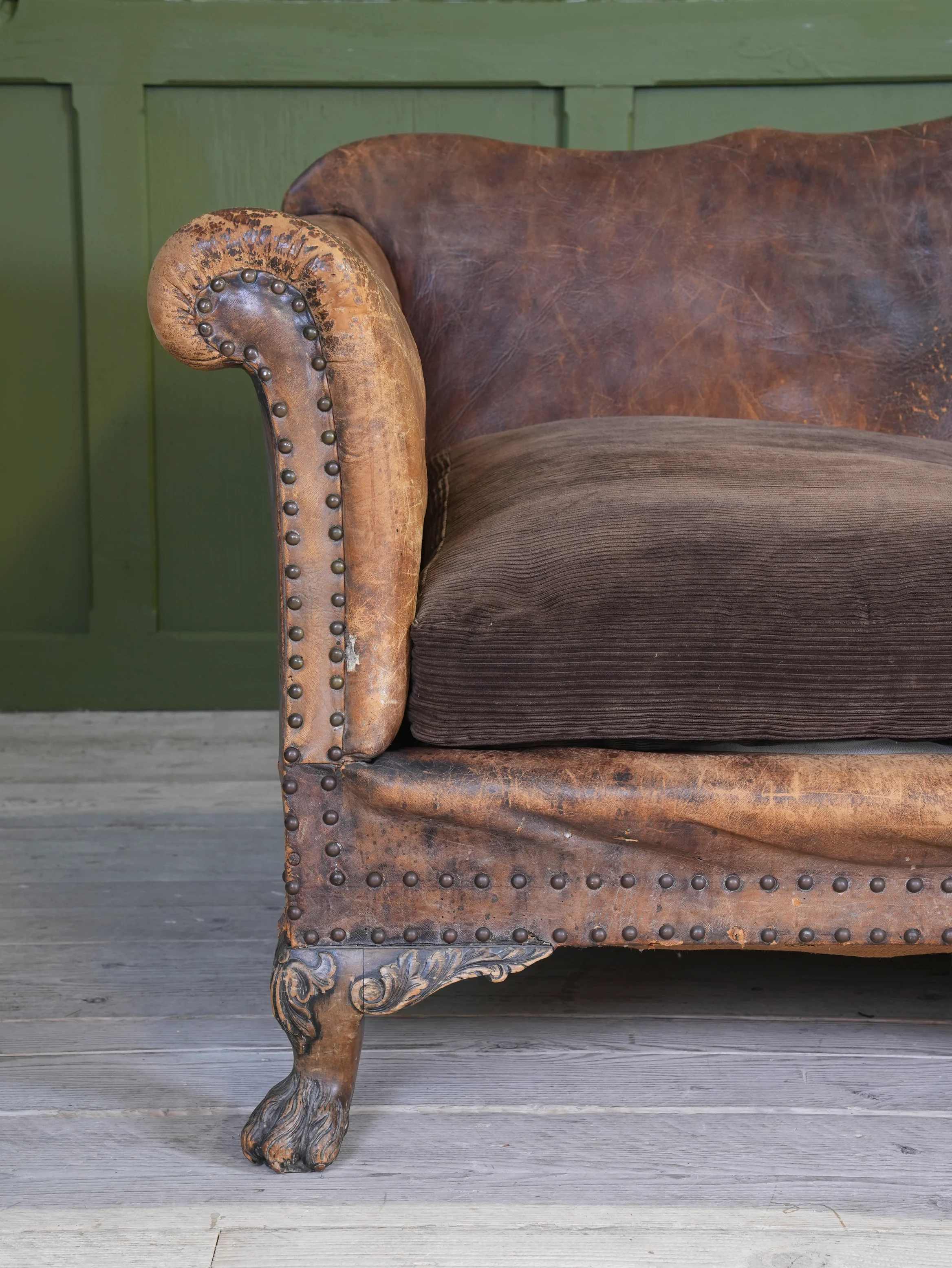 A Large Leather Camelback Sofa - Image 9